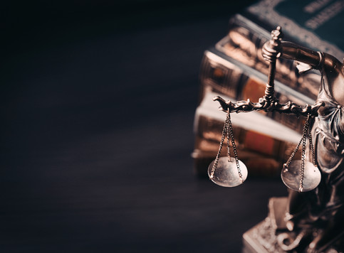 An image of a mini statue of Lady Justice