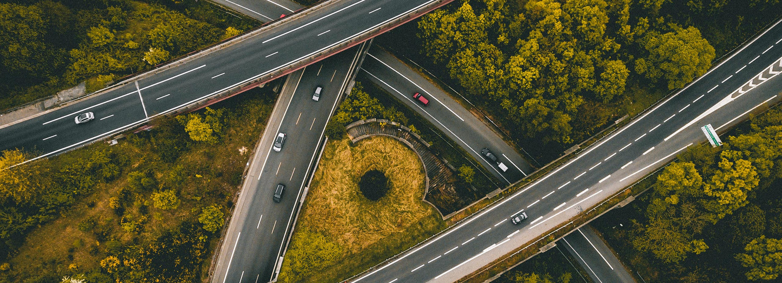 Cross roads, cars and forest 