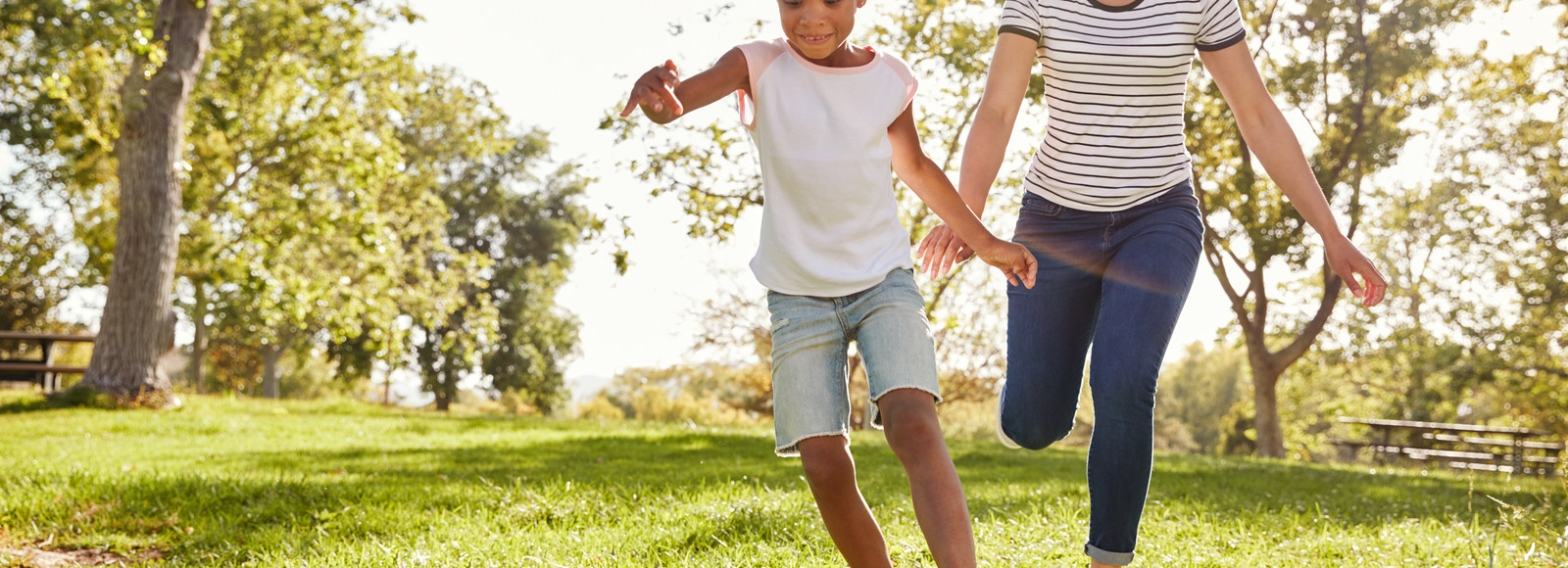 A girl and her mother playing soccer